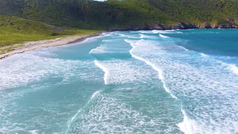 foamy waves crawling over the caribbean coast at tayrona national park, northern colombia