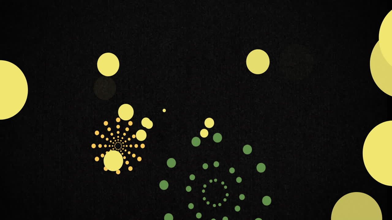 Animation of green and orange firework explosions and bokeh yellow light spots on black background