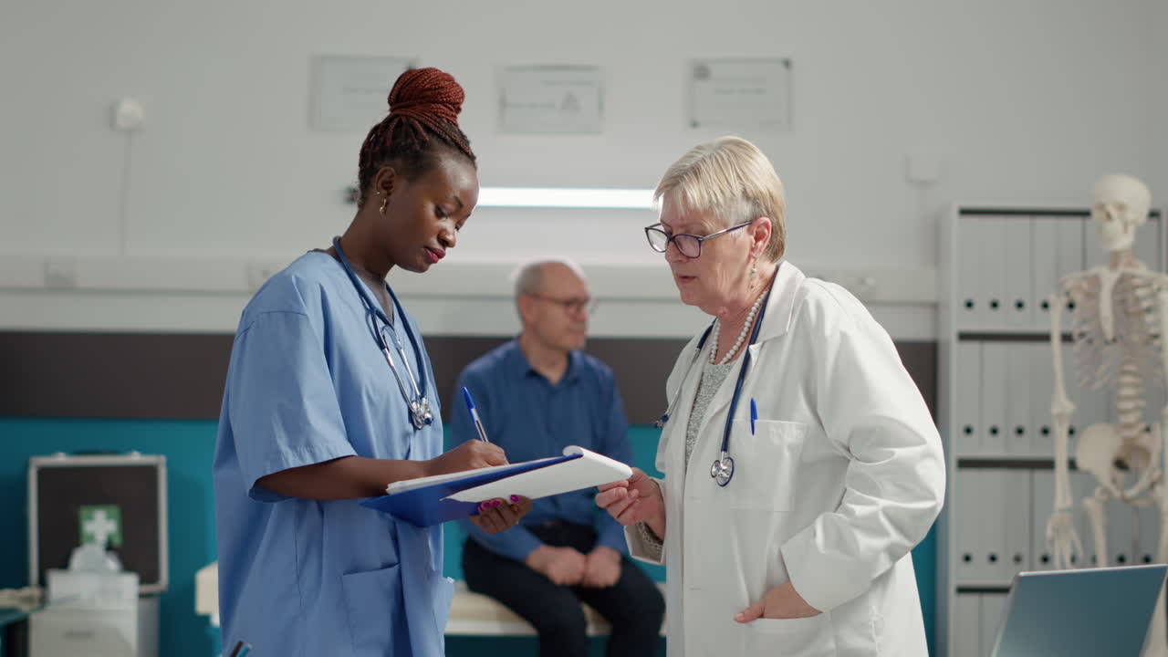 Diverse medical team analyzing checkup documents in office