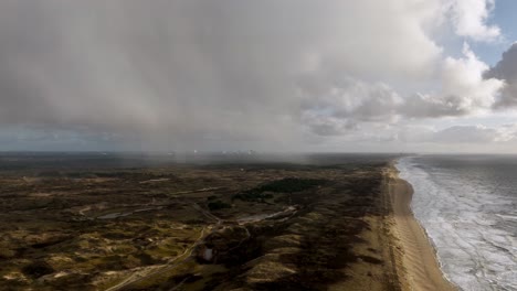 Moody-aerial-along-Dutch-coastline-over-dune-coastal-landscape