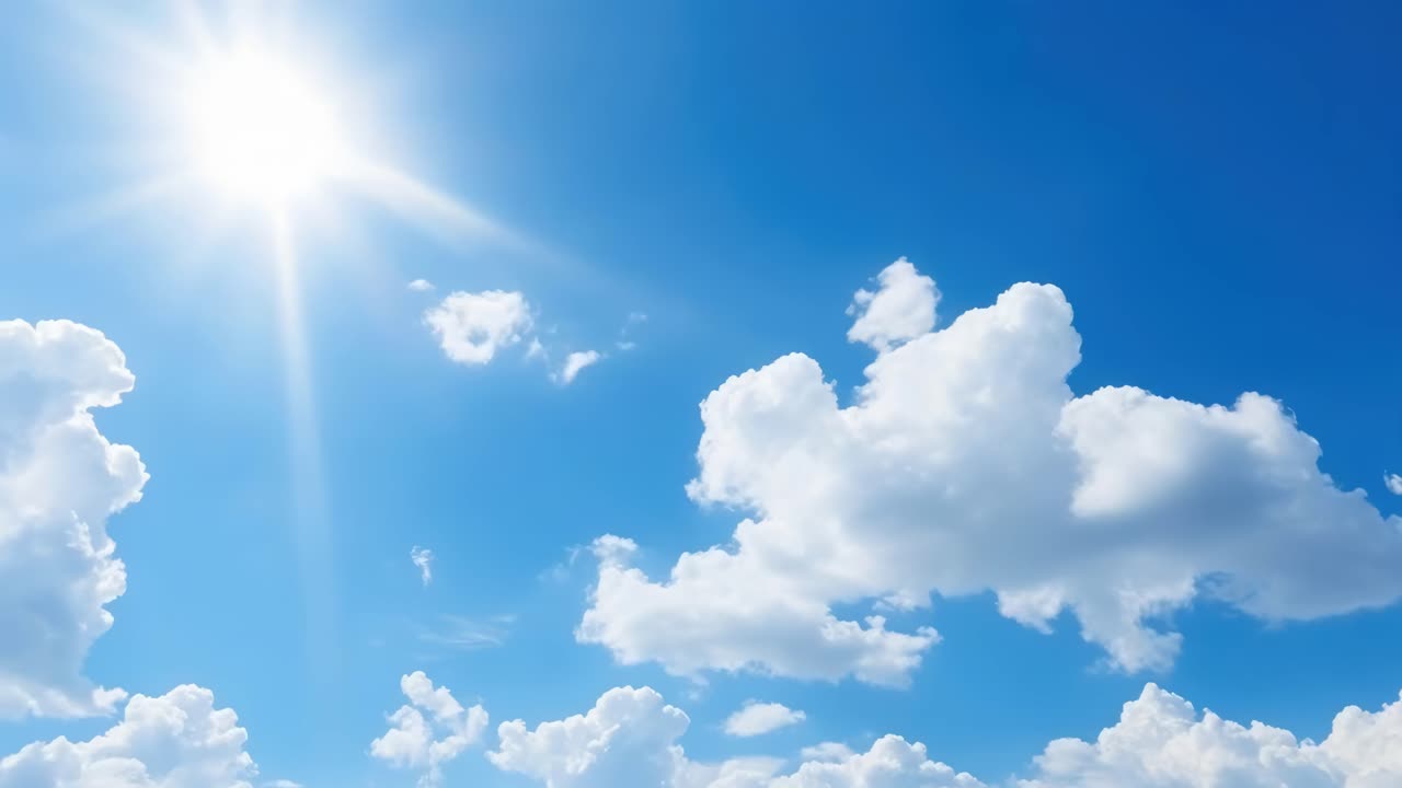 A serene video of a bright blue sky with fluffy clouds, captured from a low-angle perspective