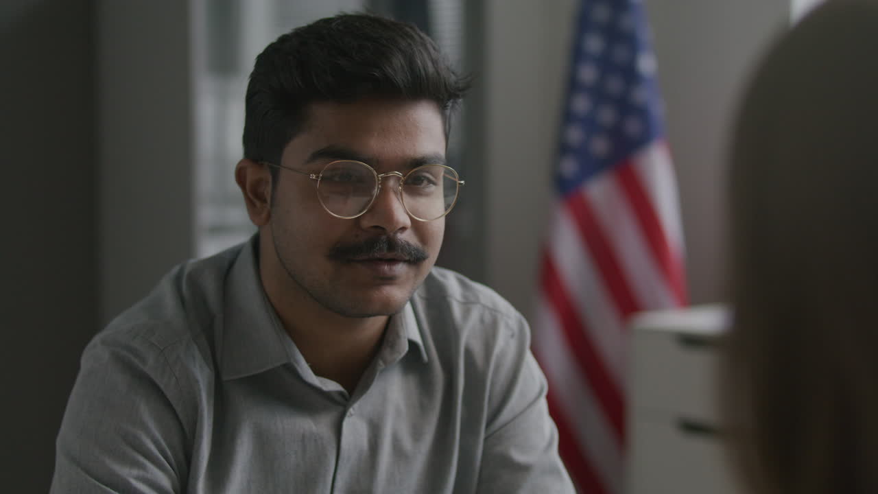 Indian Applicant Attending Visa Interview with Immigration Officer at US Embassy