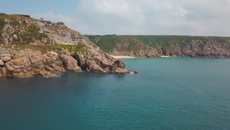 aerial: amazing cornwall coast and minack theatre on porthcurno clifftop