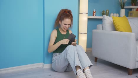 The-woman-sitting-by-the-wall-looks-at-her-empty-wallet.-Broke.