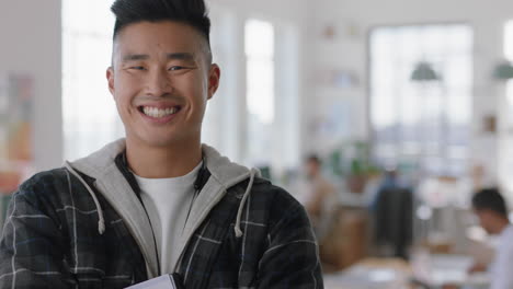 portrait young asian businessman smiling happy with arms crossed proud entrepreneur enjoying successful startup company in office workspace