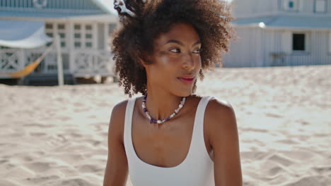 Closeup-beach-girl-resting-alone.-Carefree-stylish-woman-enjoying-sea-breeze