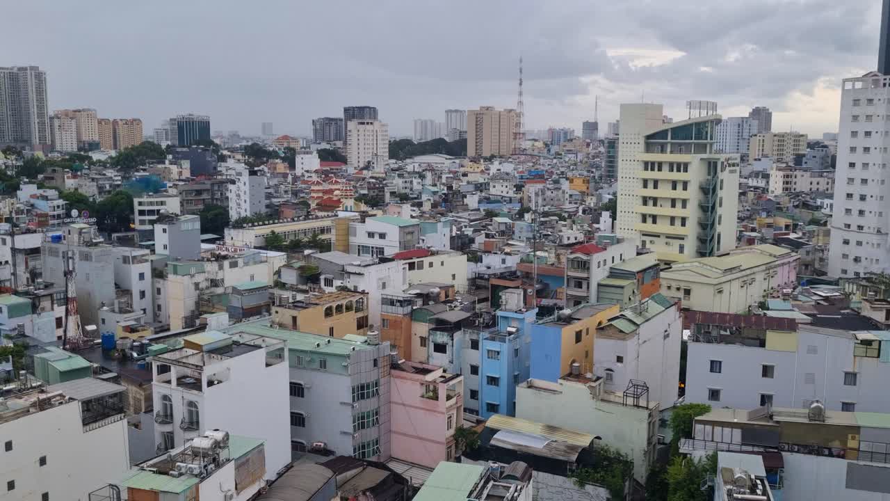 Cloudy afternoon over Saigon, Vietnam, revealing a vast sea of rooftops and urban streets stretching to the horizon in the bustling metropolis