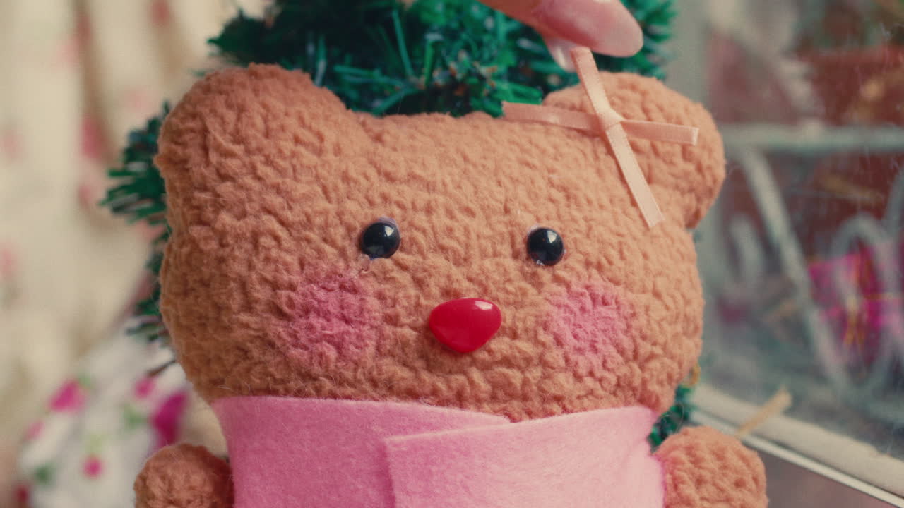 Close-up of a teddy bear with a pink bow