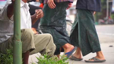 Slow-motion---close-up-shot-of-hand-of-poorman-holding-a-cigarette-and-then-sucking-it-with-his-mouth