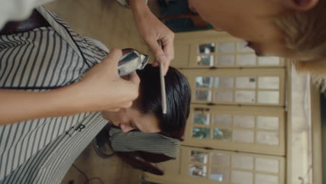 Man Getting Haircut from Professional Barber