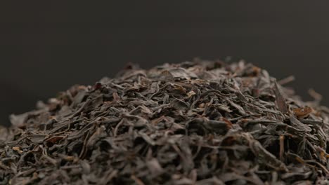 looped spinning dry black tea close-up background