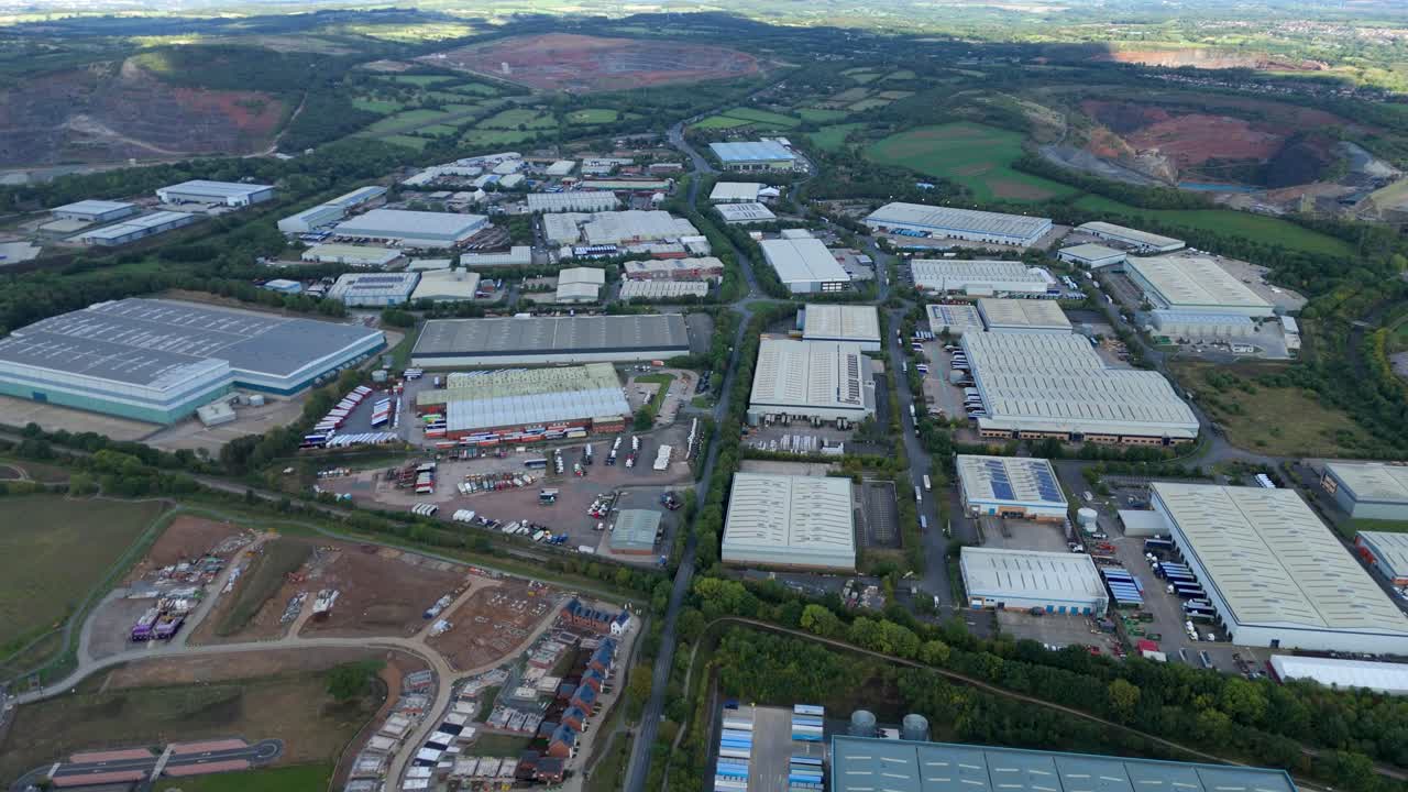Aerial drone shot of import export logistics hub in Coalville England with trucks and industrial warehouses