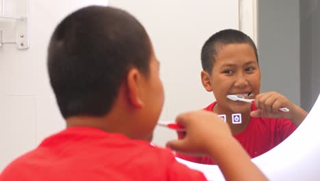 boy brushing his teeth