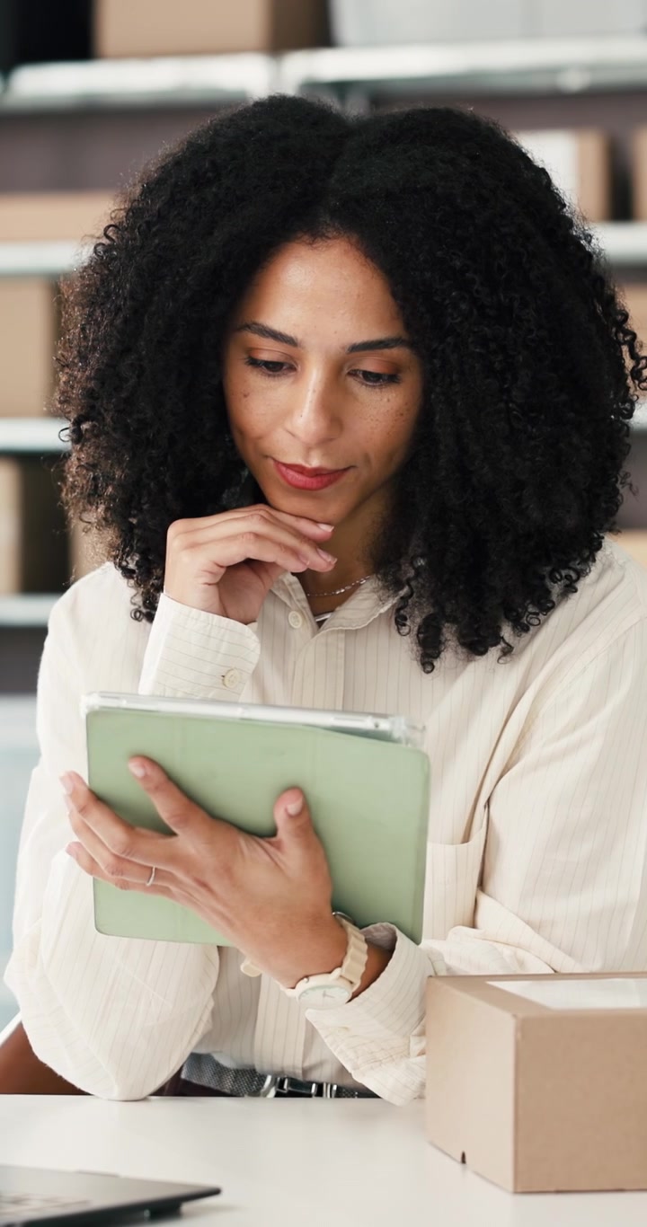 Businesswoman Using Tablet in Office