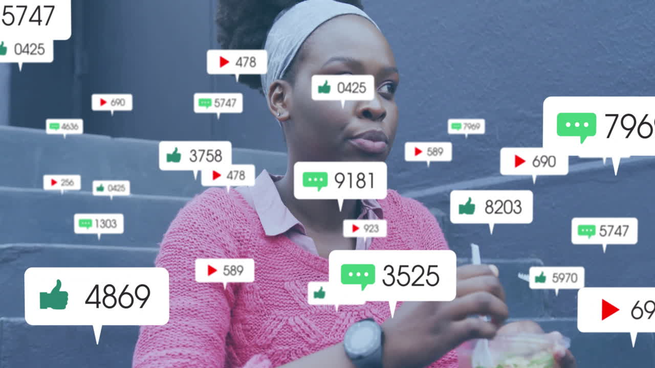 animación de iconos de los medios sobre una mujer afroamericana almorzando en la ciudad