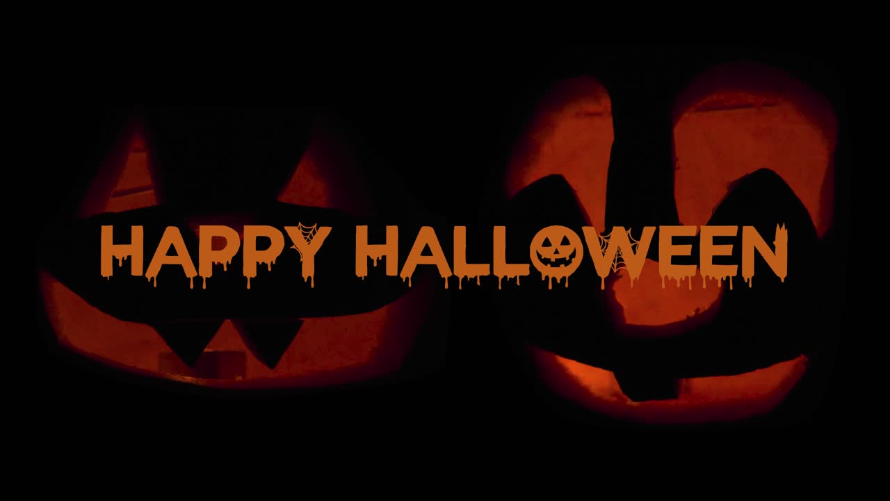 feliz halloween 2 jack o' lanterns que brillan en la oscuridad con animación de texto deseando feliz halloween: adornos de calabaza tallada con velas encendidas en el interior