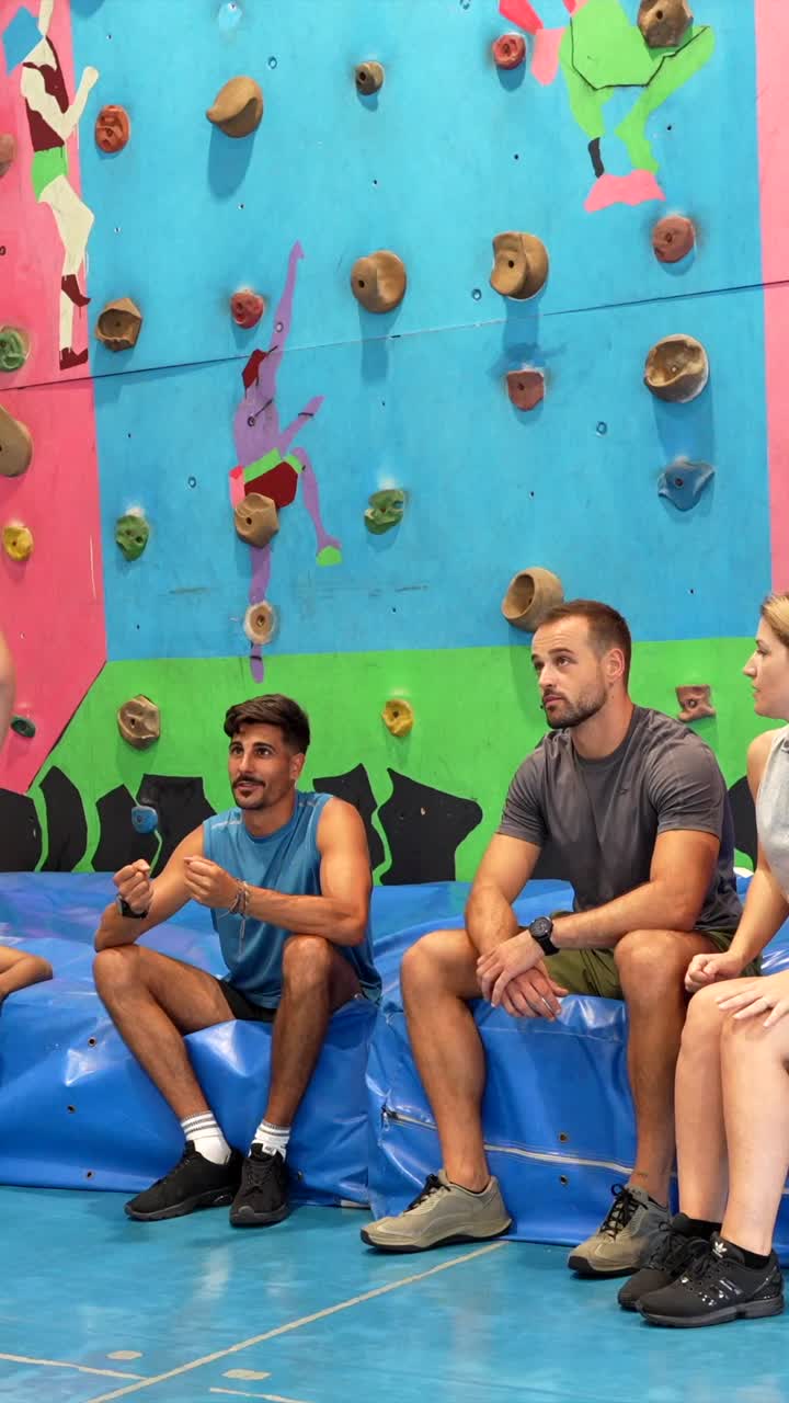 People at an indoor climbing gym
