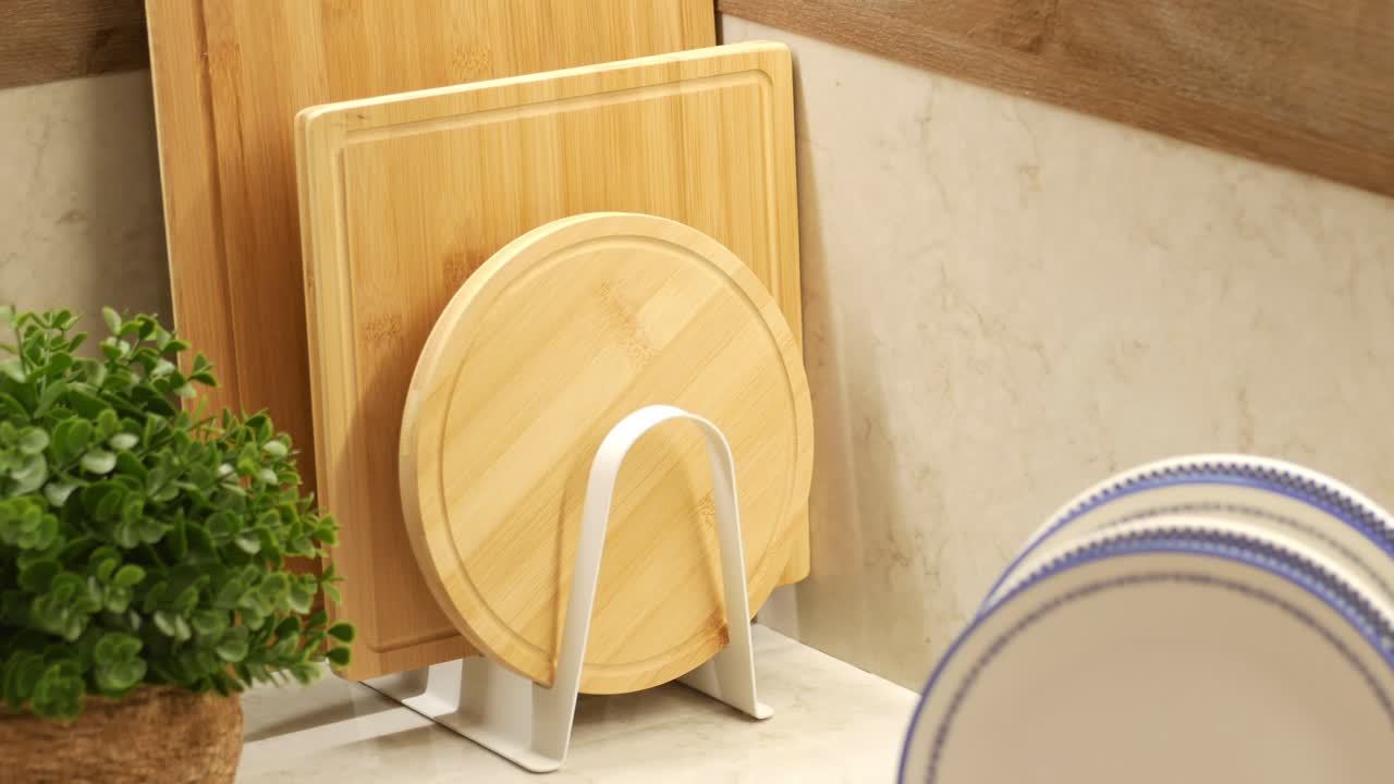 Organized Kitchen Countertop with Cutting Boards and Plates