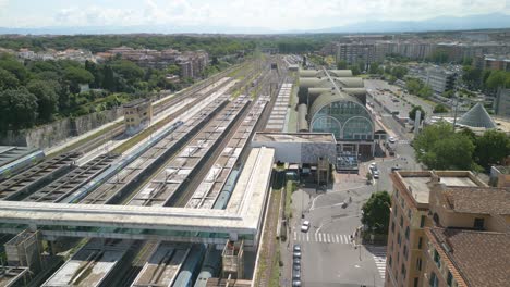 drone shot above ostiense railway station in roma, italy