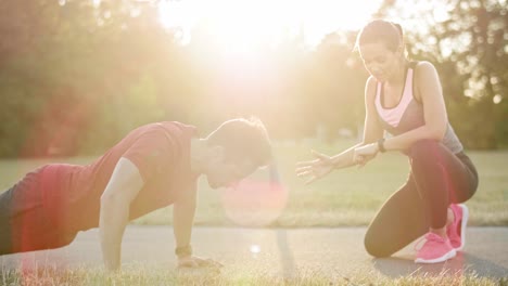 Woman-motivating-his-boyfriend-to-workout,-Katowice,-Poland