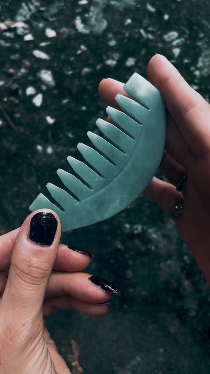 Jade Comb Held in Hands