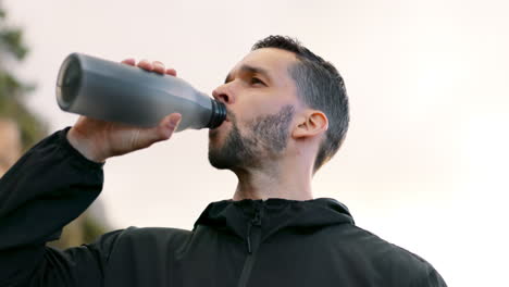 Fitness, running and drinking water with man