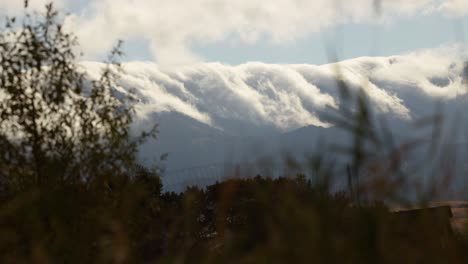 A-timelapse-of-clouds-rolling-over-the-mountains-in-Montana