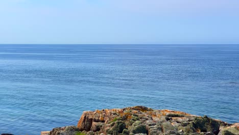 red hill above the open sea