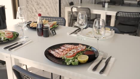 delicious grilled shrimp served with fresh greens in a vibrant dining space during a sunny afternoon in a coastal city