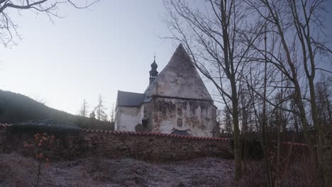 panoramic view of the gothic church in velhartice, which has a mysterious face of a girl on the plaster