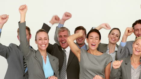 business people cheering in front of camera