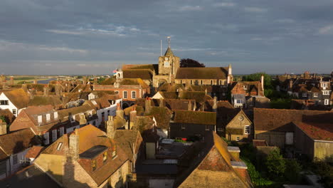 st. mary's church, anglican parish church in rye town during sunset in england, uk. - aerial shot