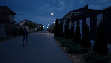 woman running at dusk in residential area