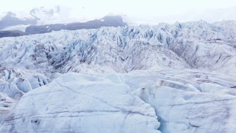 jagged ice on surface of big large glacier in iceland, fjallsárlón, aerial