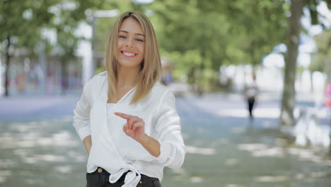 cheerful young woman showing victory sign