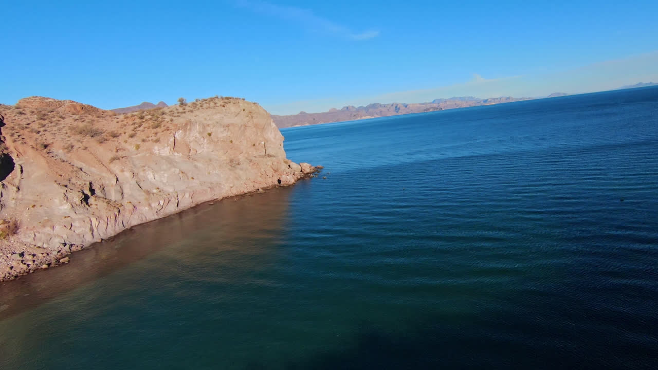 FPV drone shot of Baja California unique desert landscapes, rock formations and turquoise water