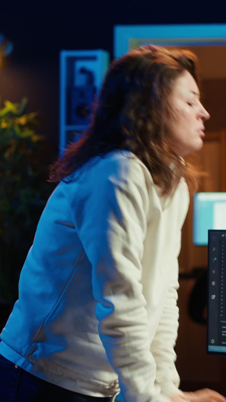 Vertical video IT expert taking break from work to relax muscles