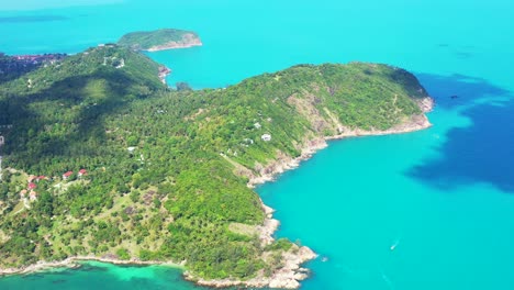 rocky palm tree coast and clear blue water of siam sea