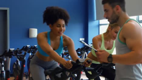 spin class working out in the gym