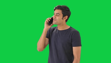 Happy-Indian-man-talking-to-someone-on-call-Green-screen