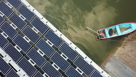 Solar-panels-installation-project-for-floating-solar-farm-in-Asia,-aerial-view