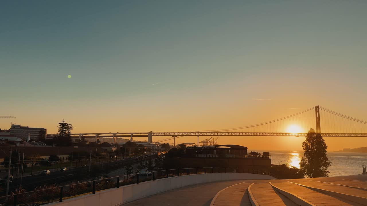 Sunset over the 25 de Abril Bridge in Lisbon
