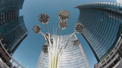 milan city curved glass buildings in modern downtown business square. italy