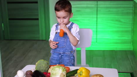 child arranging vegetables on a table. a young child in overalls sorts colorful vegetables on a table in a bright kitchen, focused on the task at hand