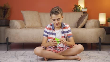 Boy-playing-with-a-intelligence-cube.