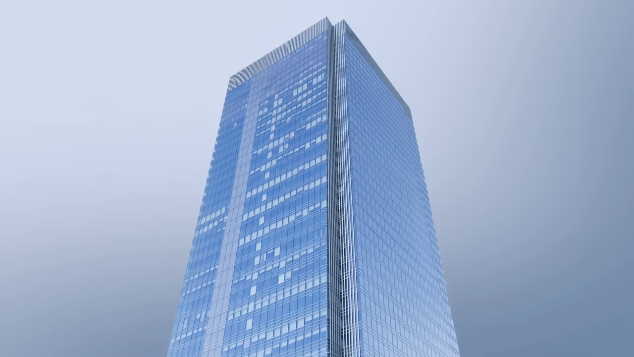 Moderno grattacielo in vetro con inquadratura panoramica verso l'alto contro un cielo sereno.