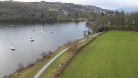 lake with sailboats, slow drone view near parson wyke, windermere