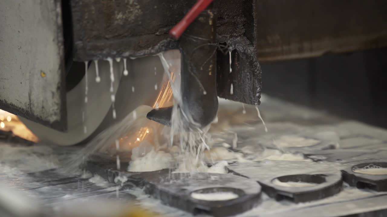 Metal grinding machine. Industrial concept grinding metal with sharp sparks. Grinding smooths steel and iron using modern equipment. Machinery and professional equipment concept. Close up shot