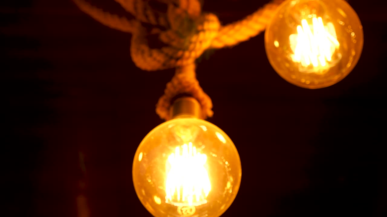 Round light bulb against a dark background