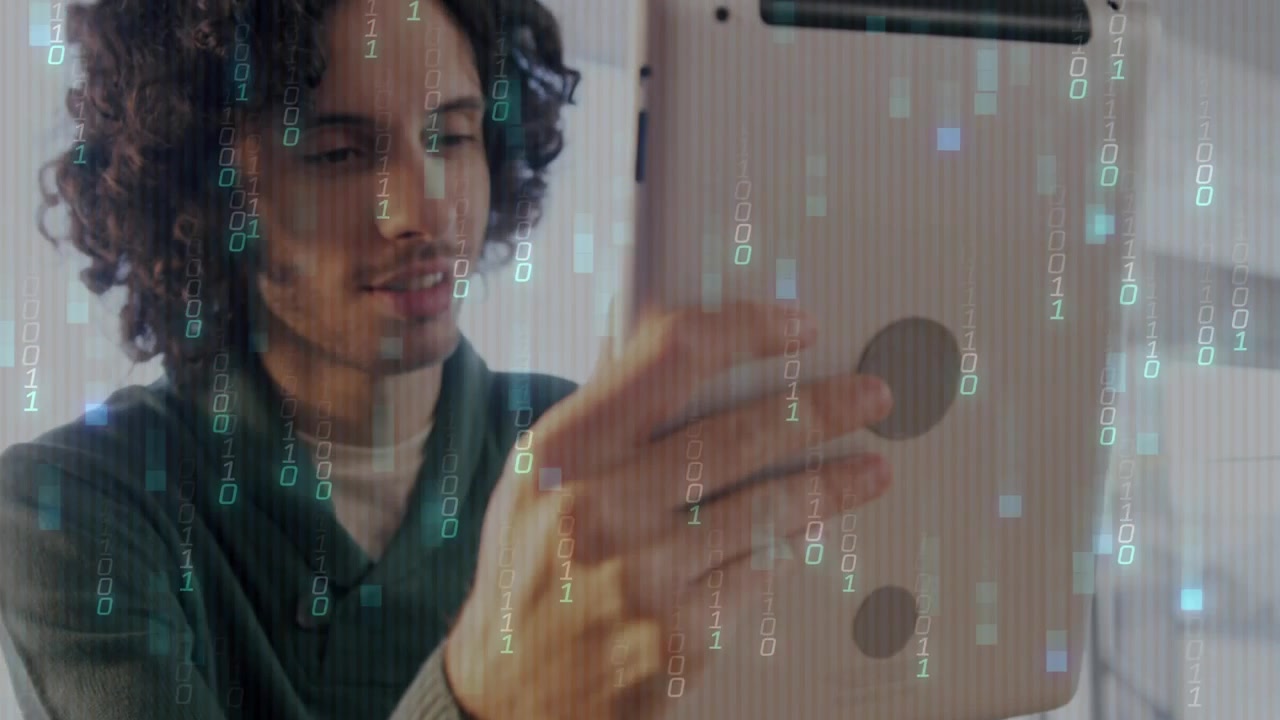 Man shifting tablet down reading content as floating graphics appearing suggesting tech